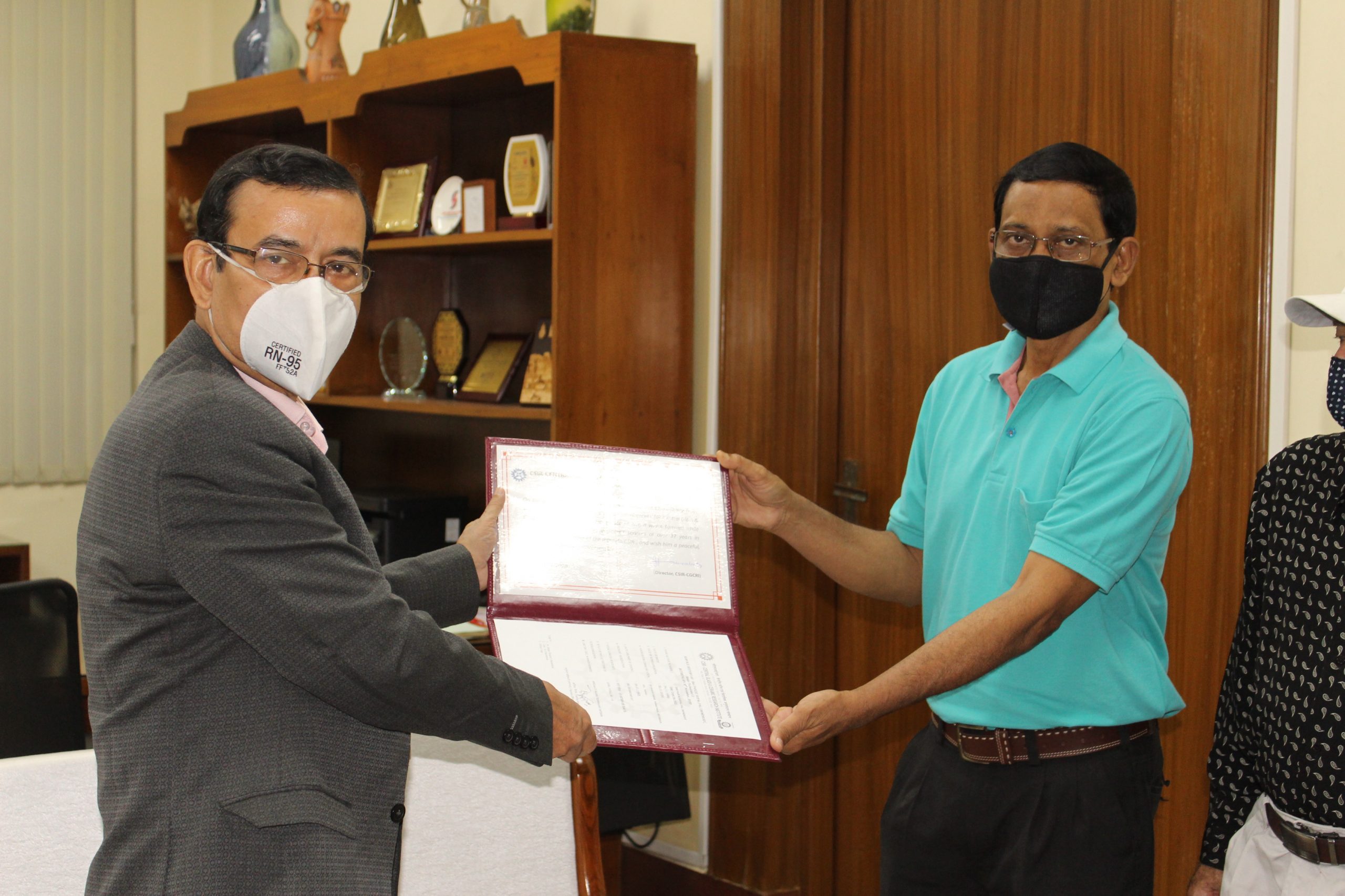 Acting Director presenting the Cetificate to Sri Panchu Gopal Pal Chowdhury, Senior Technician (2) upon superannuation from Council Service in November, 2020