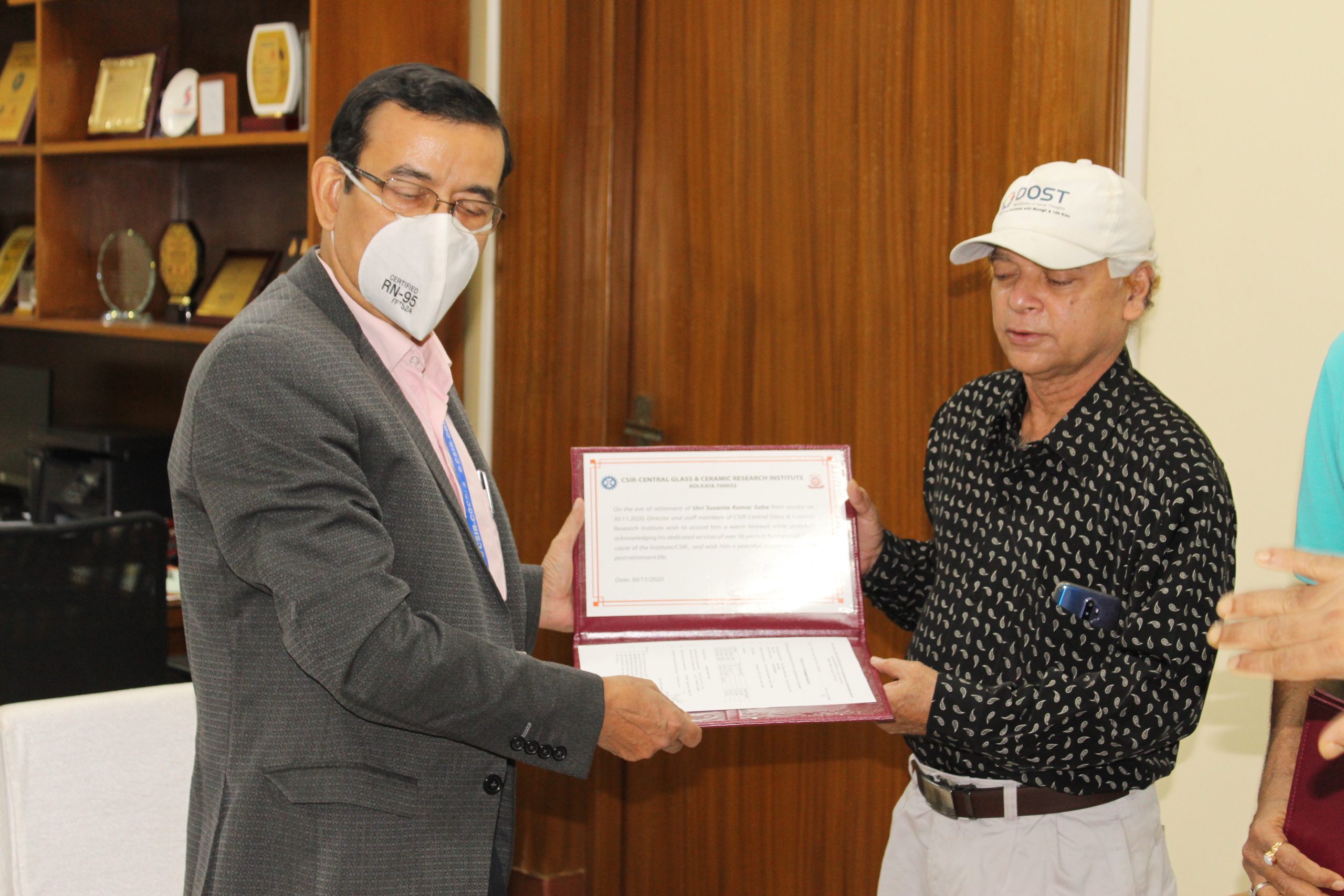 Acting Director presenting the Cetificate to Sri Sushanta Kumar Saha, Assistant Section Officer upon superannuation from Council Service in November, 2020