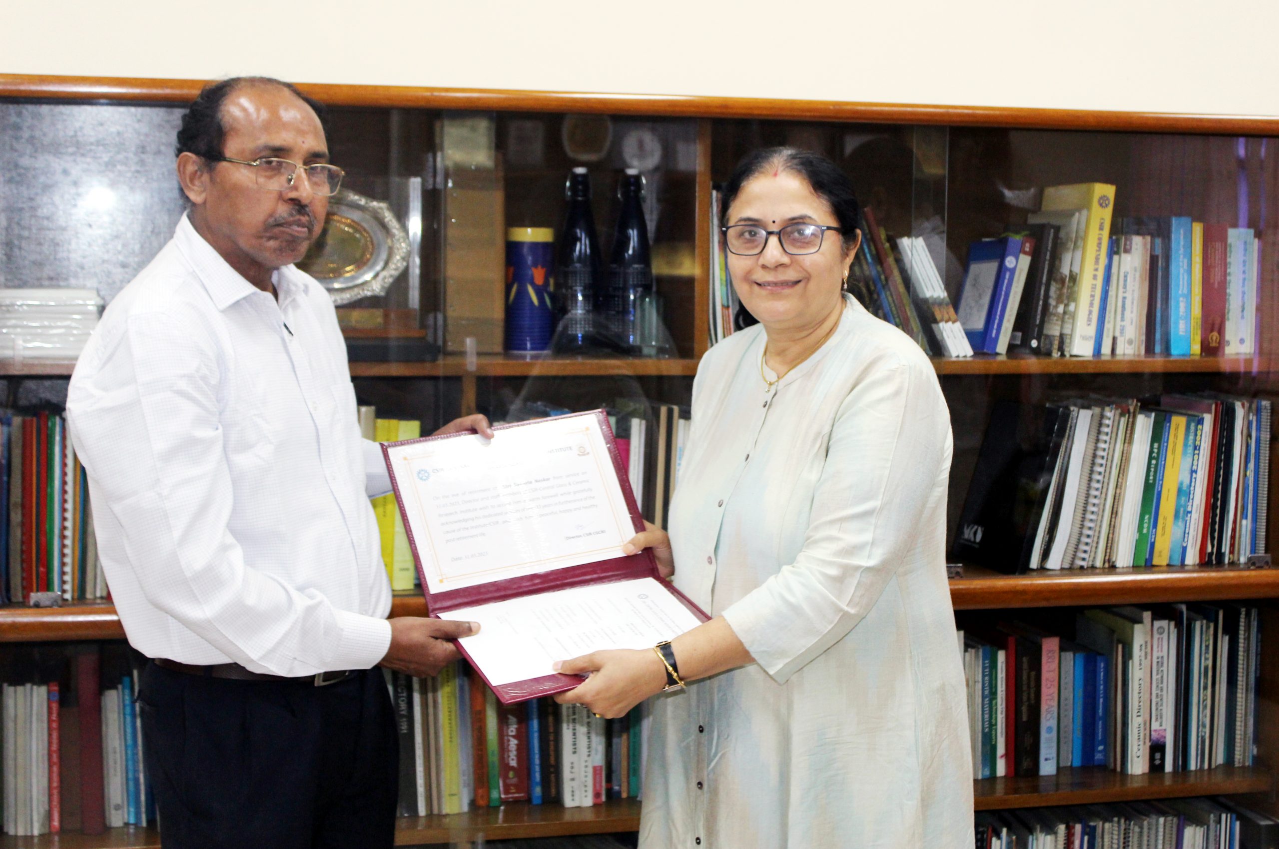 Director presenting retirement certificate to Sri Susanta Naskar
